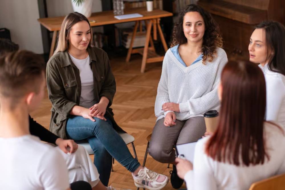 Young adults participating in group therapy as part of a Partial Hospitalization Program in Columbus Ohio, building peer support and communication skills.