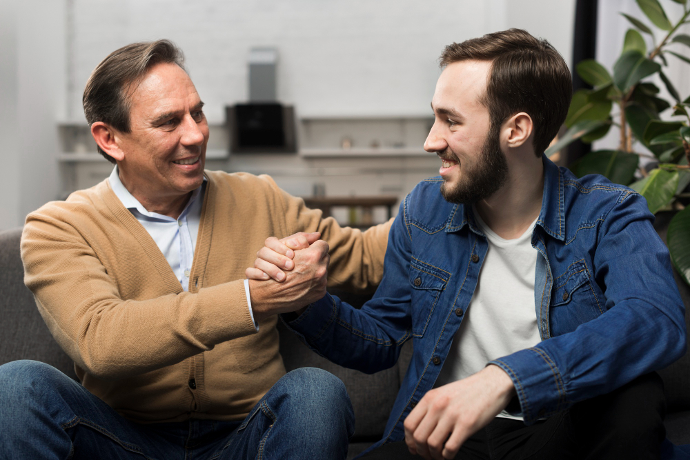 Two men supporting each other on their recovery journey in a Sober Living Program in Columbus, OH