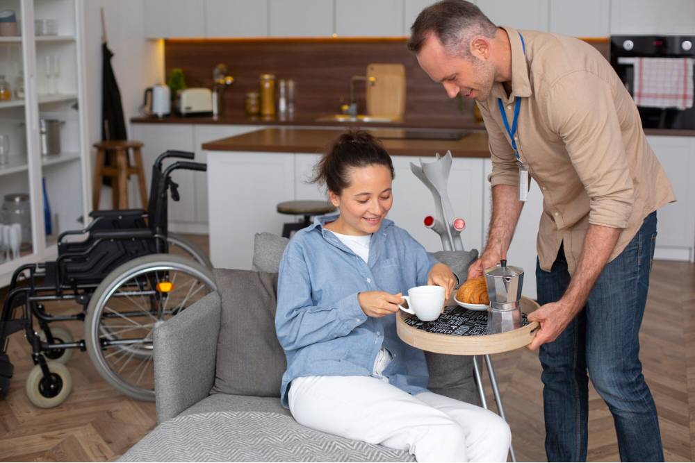 A caregiver supports a patient with mobility challenges during her recovery at Outpatient Rehab in Columbus OH, showing compassionate daily assistance.