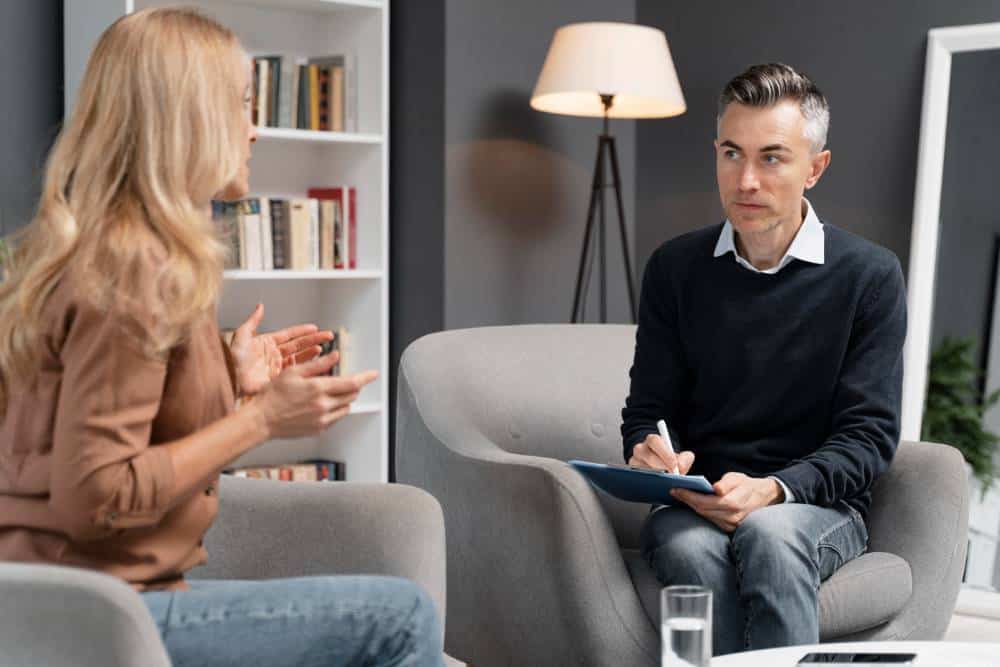 A therapist actively listening during an individual counseling session, illustrating the personalized approach of CBT Therapy in Columbus Ohio.