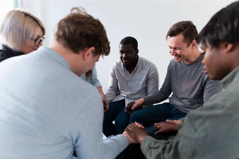 A supportive group therapy meeting during CBT Therapy in Columbus Ohio, fostering connection and shared growth.